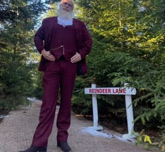 Mr Claus mingling at a festive office party