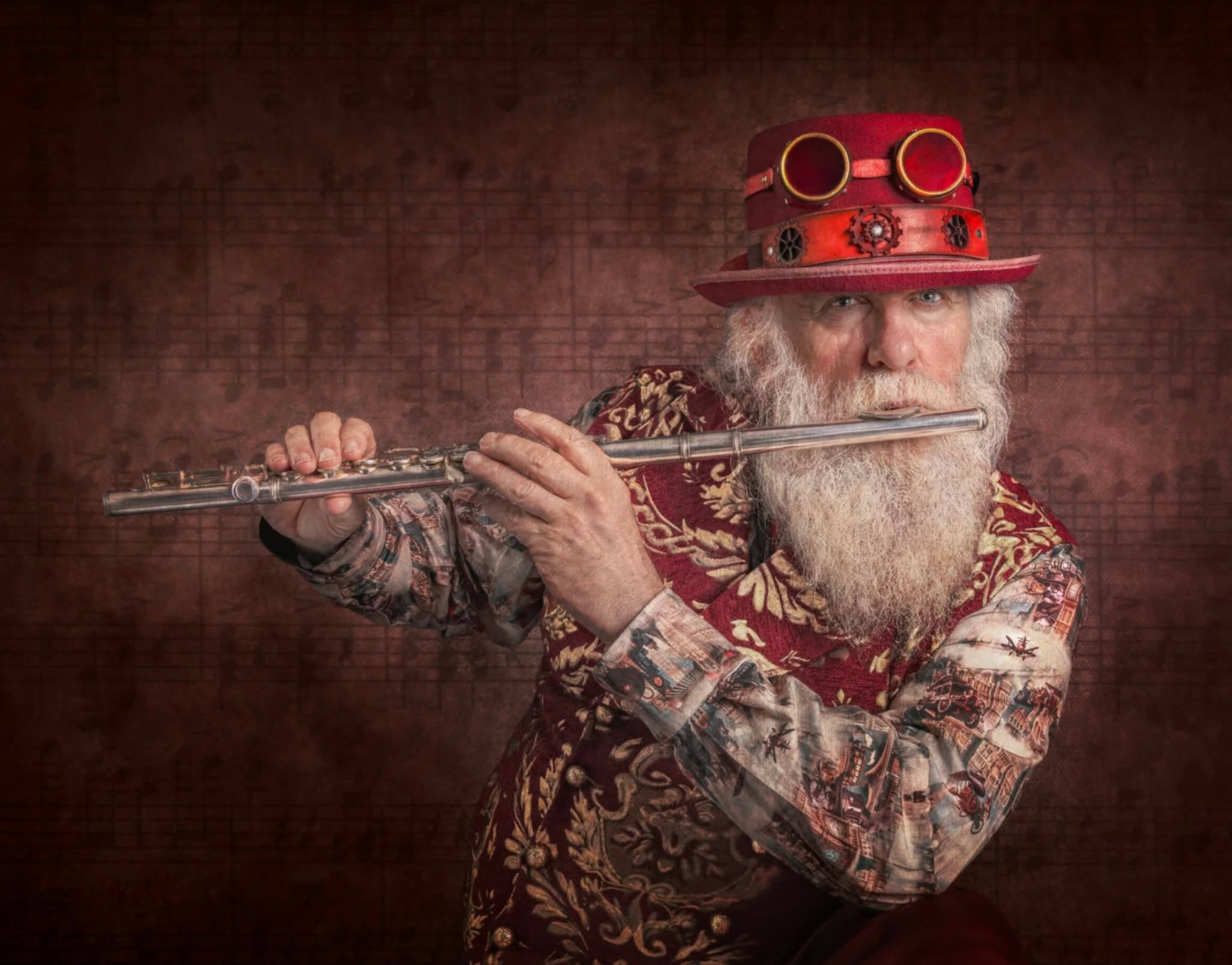 Steampunk Santa holding his hat and goggles