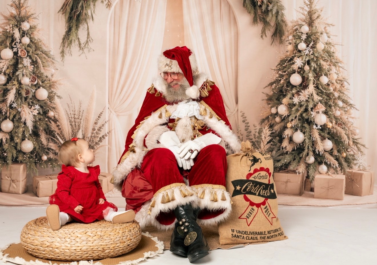 Santa with a little one — a precious first Christmas moment